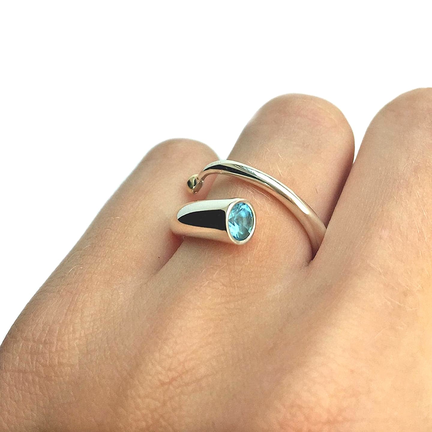 Bague Spirale argent et topaze bleue